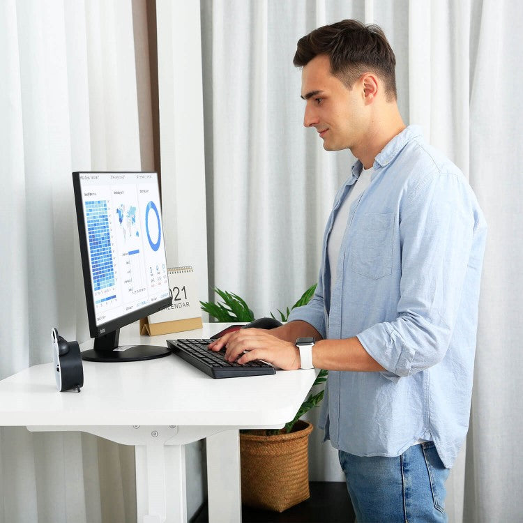 White sitting to standing desk free to stand at work