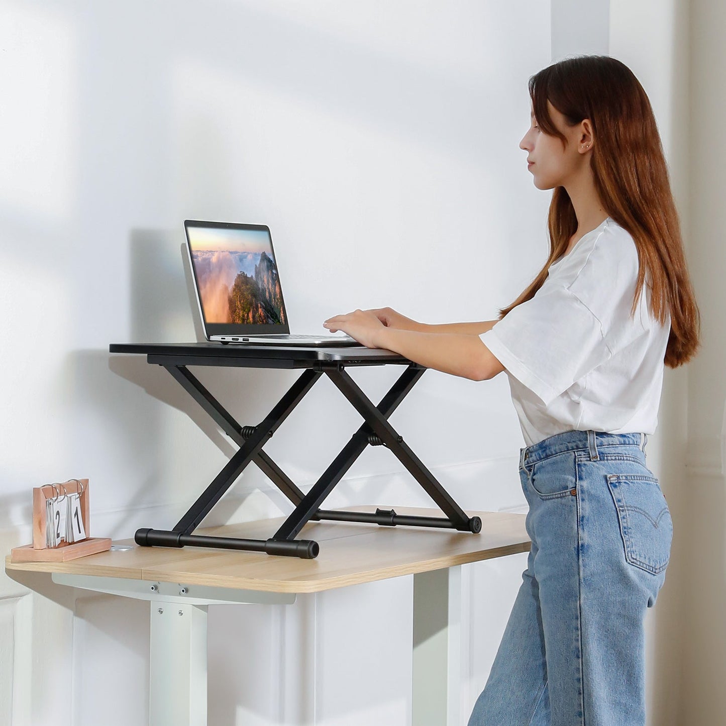 standing at work with a standing desk comverter