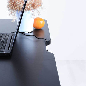 Black home office standing desk with easy cable management